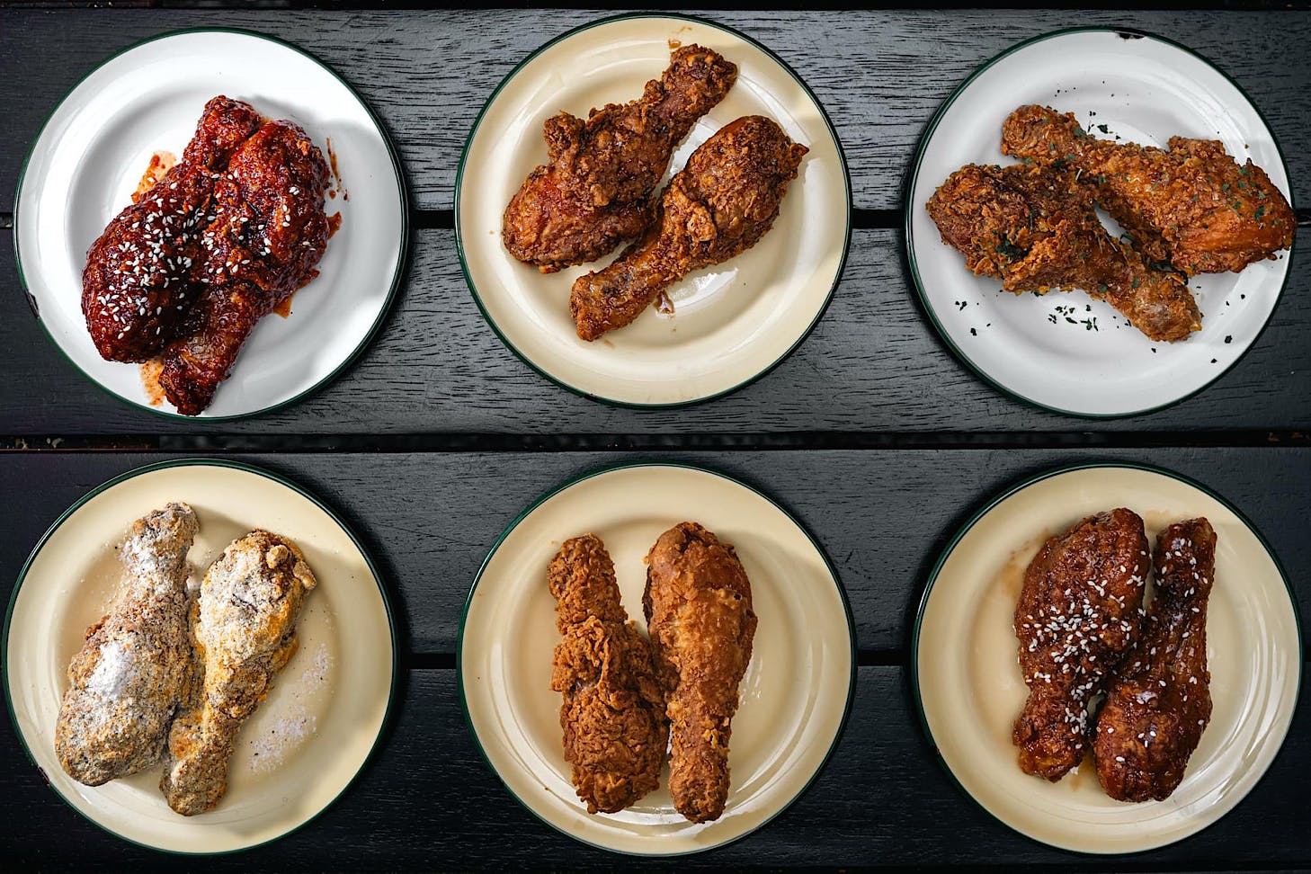 Six plates of different flavoured drumsticks.